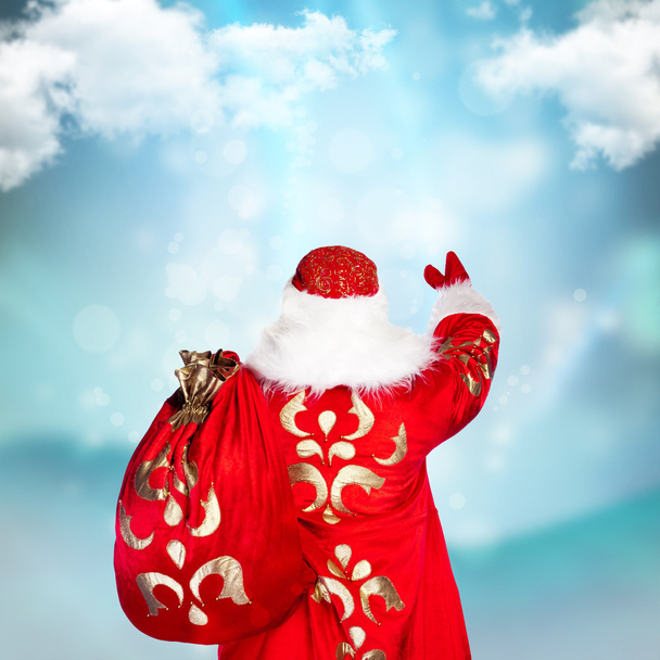 Santa Claus is making magic, photo from behind - Foto, Imagem