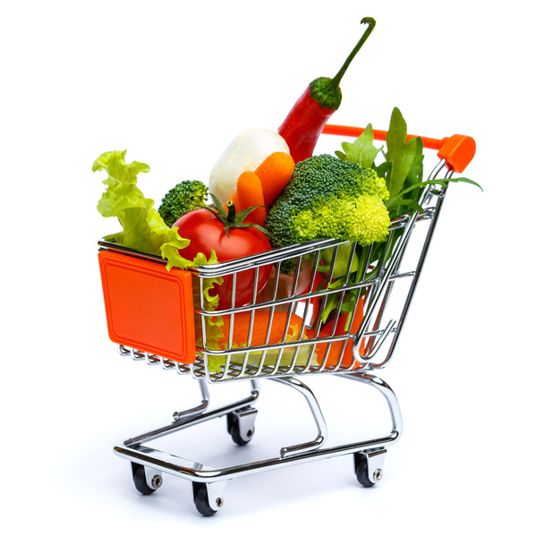 mini shopping cart full with vegetables - Foto, Imagen