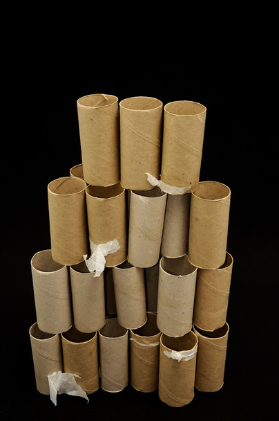 Empty Toilet Rolls Stack Up On a Black Background - Photo, Image