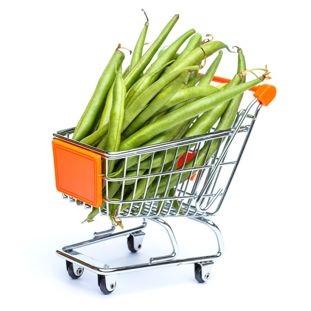 mini shopping cart full with green beans - Foto, afbeelding