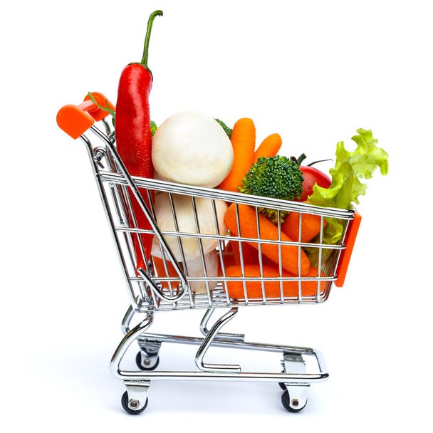 mini shopping cart full with vegetables - Foto, afbeelding