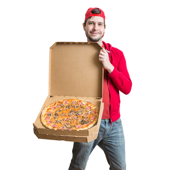 Pizza delivery concept. Young man is showing tasty pizza in box. Isolated on white background. - Foto, Bild