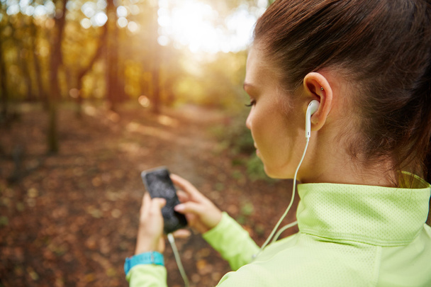 Setting up playlist for jogging - Foto, immagini