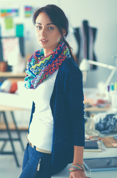 Beautiful fashion woman designer standing in studio - Foto, Bild