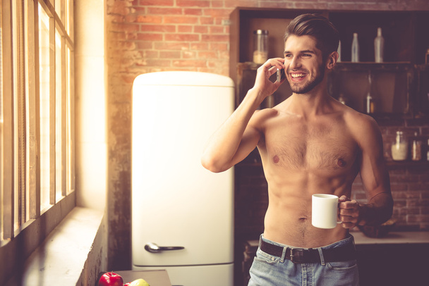 Sexy young man in kitchen - Foto, Imagem