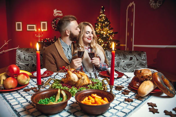 Beautiful couple in a decorated festive interio - Fotoğraf, Görsel