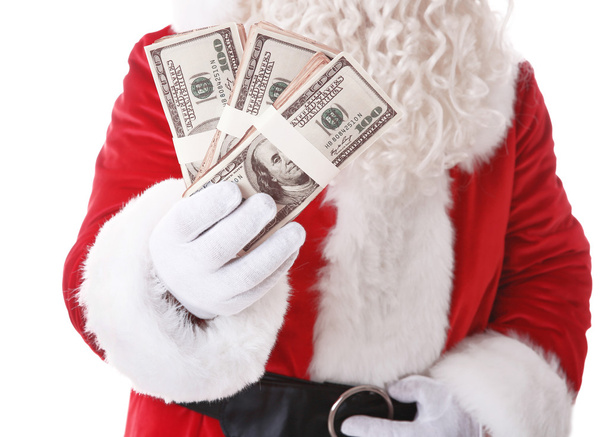 Santa Claus hand holding money on white background - Foto, Imagen