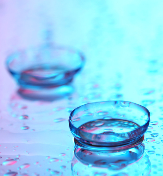 contact lenses, on pink-blue background - Photo, image