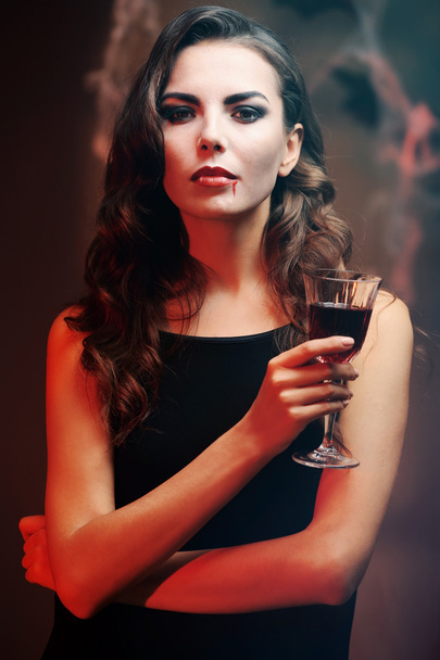 Young woman dressed as vampire for Halloween party, closeup - Foto, Bild