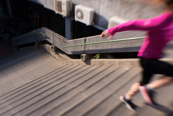 woman jogging on  steps - Фото, изображение
