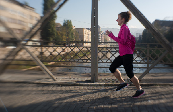 sporty woman jogging on morning - 写真・画像