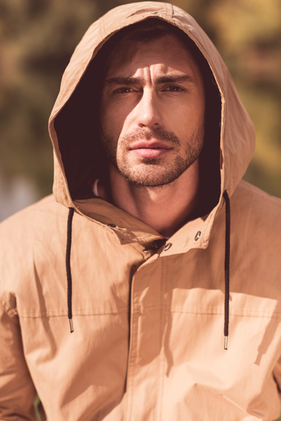 Handsome man in jacket with hood - Photo, Image