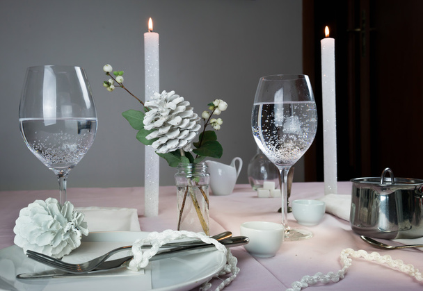 elegant table setting. Christmas. romantic dinner - tablecloth, cutlery, candles, flowers, buds. - Фото, изображение