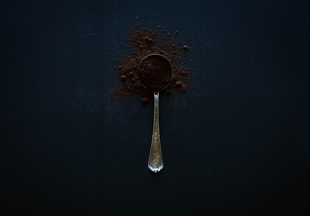 Vintage old aged spoon with coffee - Foto, Imagem
