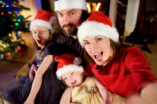 Happy family taking selfie on Christmas  - Photo, Image