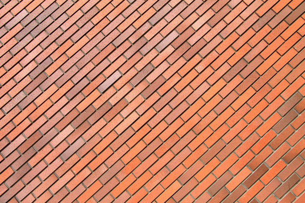 Rode bakstenen muur, achtergrond, diagonale positie, stenen textuur. - Foto, afbeelding