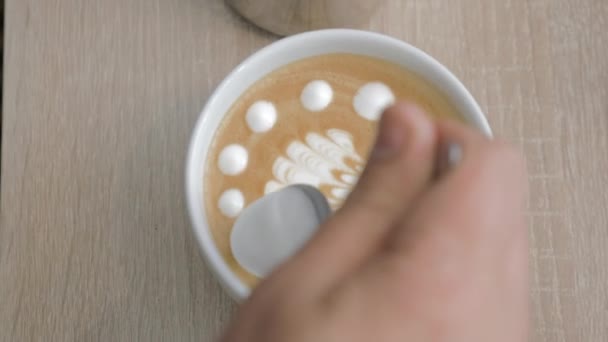 Close-up shot of barista finishing cream picture on latte matcha - Footage, Video