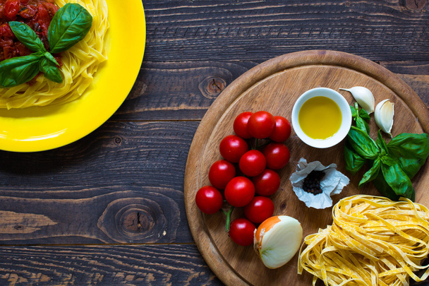 Italian food cooking ingredients for tomato pasta - 写真・画像
