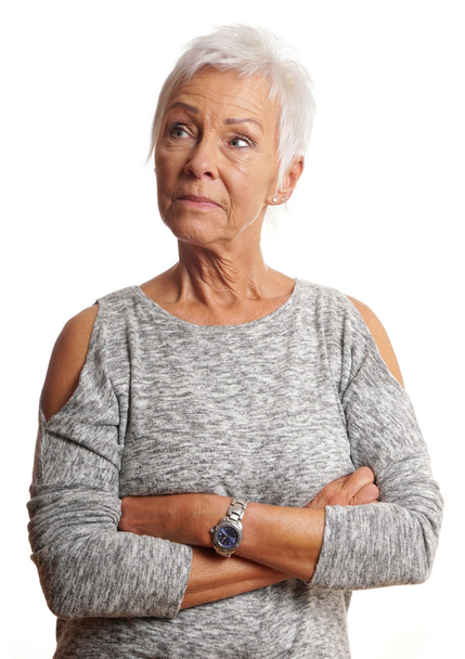 mature woman with arms folded looking away - Photo, Image