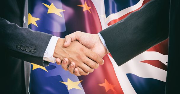 Handshake on EU - UK  flags background - Foto, imagen