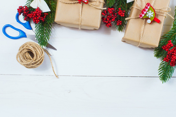 Christmas gift and a sprig of pine needles on a white background - Zdjęcie, obraz