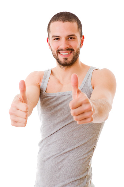 Young casual man going thumbs up, isolated on white background - 写真・画像