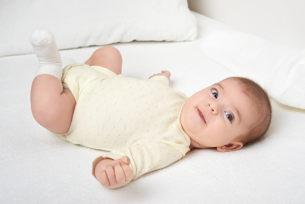 baby portrait lie on white towel in bed - Photo, Image