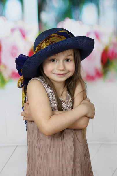 Cute little girl in big blue hat - Fotografie, Obrázek