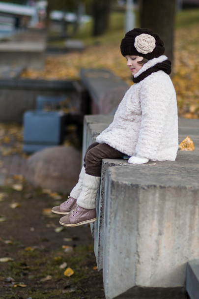 Little fashionable girl in warm clothes - Zdjęcie, obraz