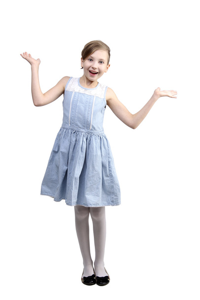the portrait of surprised smiling young little girl holding hands up over white background - Photo, image