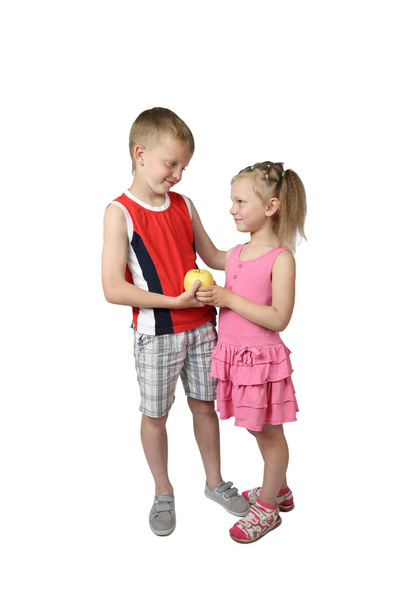Boy gives little girl apple - Photo, image