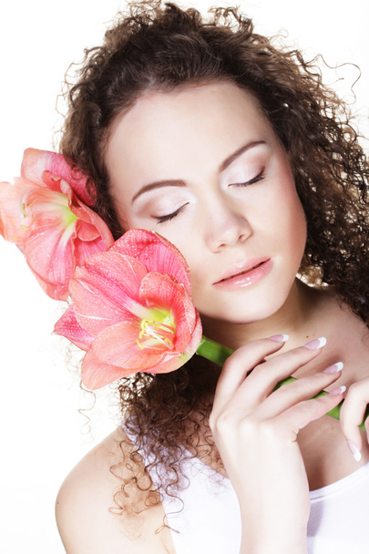 young beautiful woman with big pink flowers - Foto, Bild