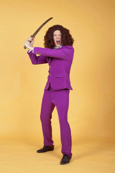 Man in Purple Suit carrying sword - Photo, Image