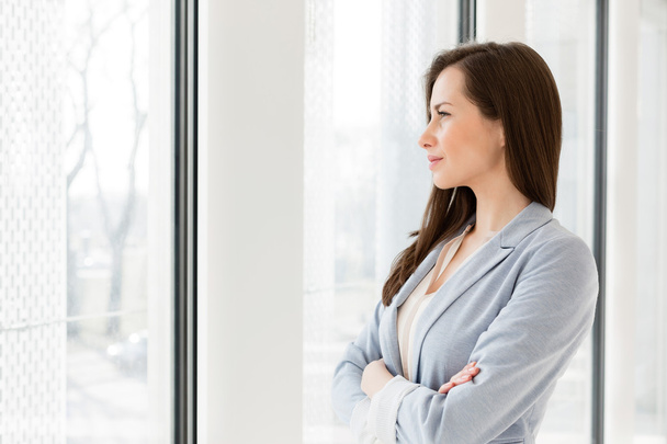 Businesswoman looking at window  - Photo, image