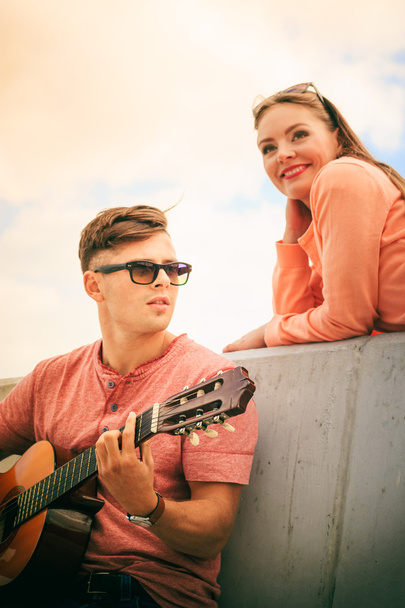Happy couple with guitar outdoor - 写真・画像