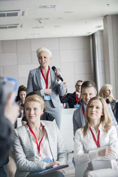 Businesswoman asking questions during seminar  - Photo, Image