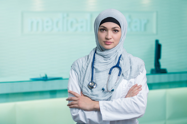 Smiling confident muslim female doctor. - 写真・画像