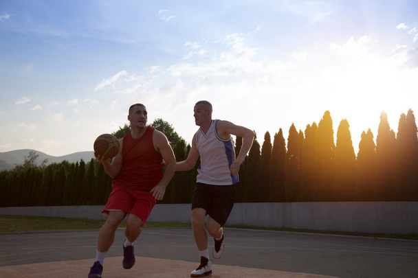 Two basketball players on the court outdoor - Fotoğraf, Görsel