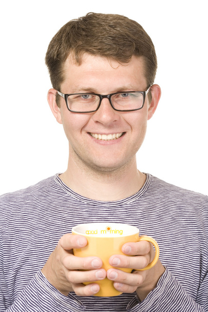 A smiling man with a yellow cup - Φωτογραφία, εικόνα