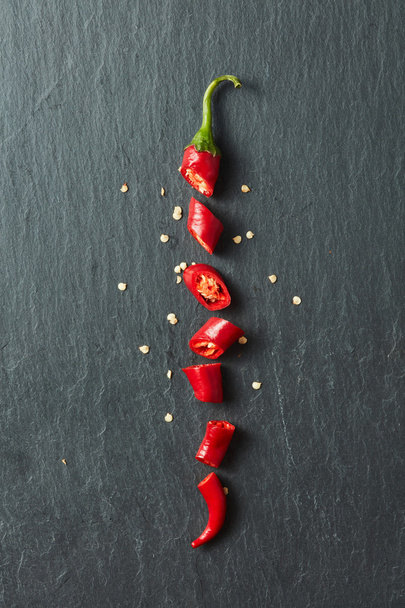Red chilli cut into slices - Foto, Bild