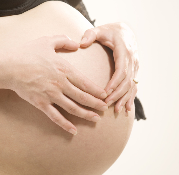 Belly of pregnant woman - Фото, изображение