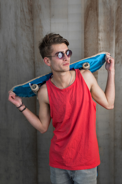 Young fashion guy with a skateboard - Zdjęcie, obraz