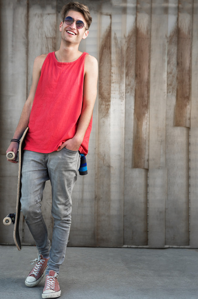 Young fashion man with skateboard - 写真・画像