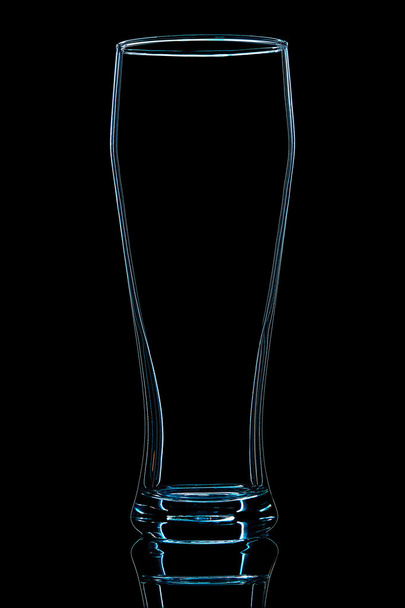 Silhouette of blue beer glass on black - Photo, image