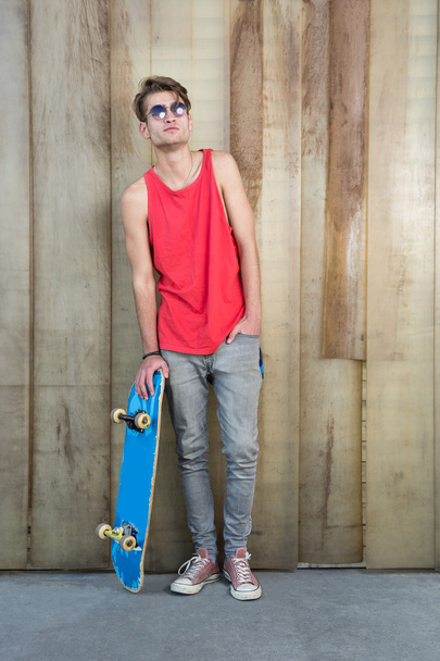 man with skateboard on street - Фото, изображение