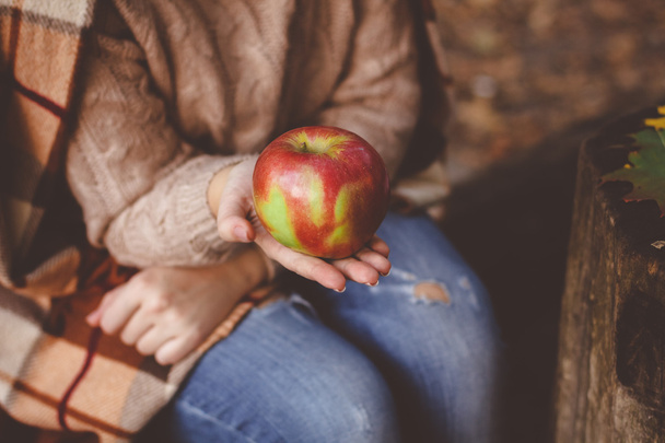 woman holding ripe red apple - Fotoğraf, Görsel