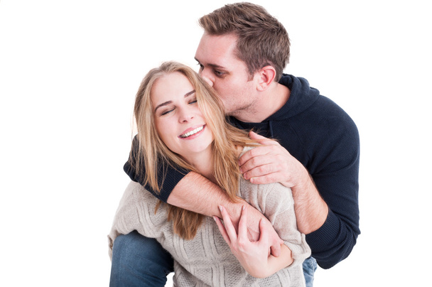 Happy couple posing being affective and kissing - Φωτογραφία, εικόνα