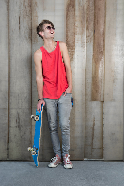 Young fashion guy with a skateboard - Fotoğraf, Görsel