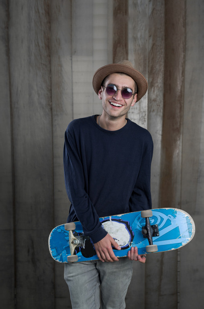 Young fashion guy with a skateboard - Photo, Image