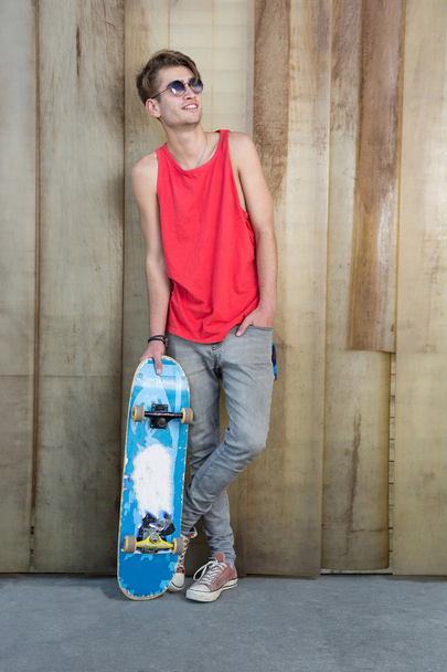 Young fashion guy with a skateboard - Foto, Imagem